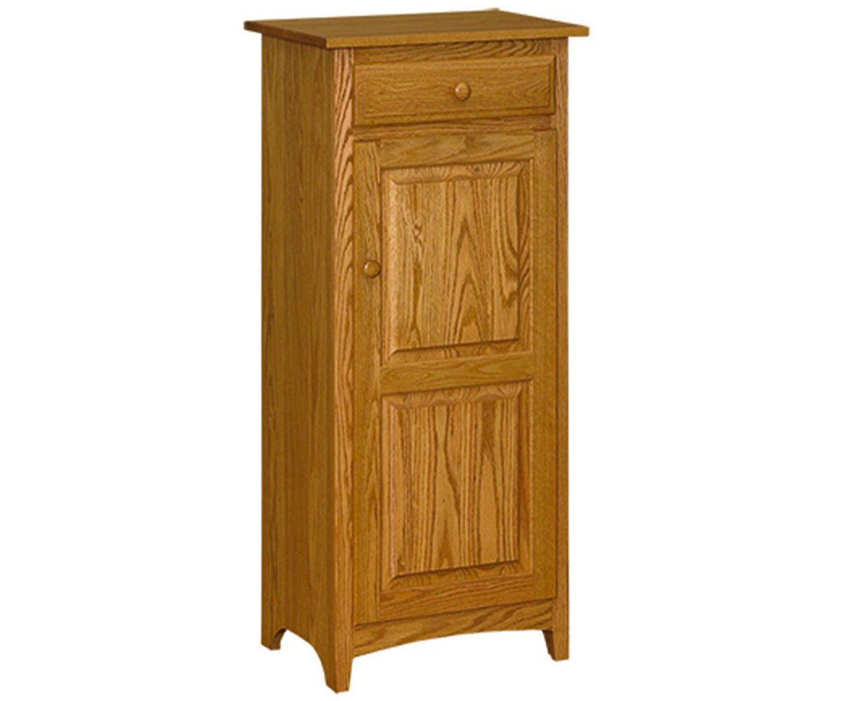 Tall oak Shaker jelly cupboard with one drawer above a two panel door with a wood knob, on a white background