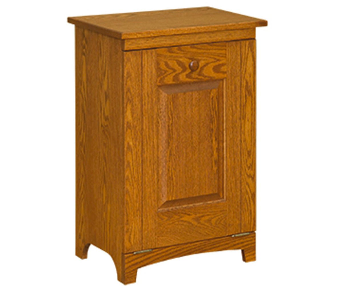 Oak tilt-out trash bin with a single paneled door front, wood knob and arched base, shown on a white background