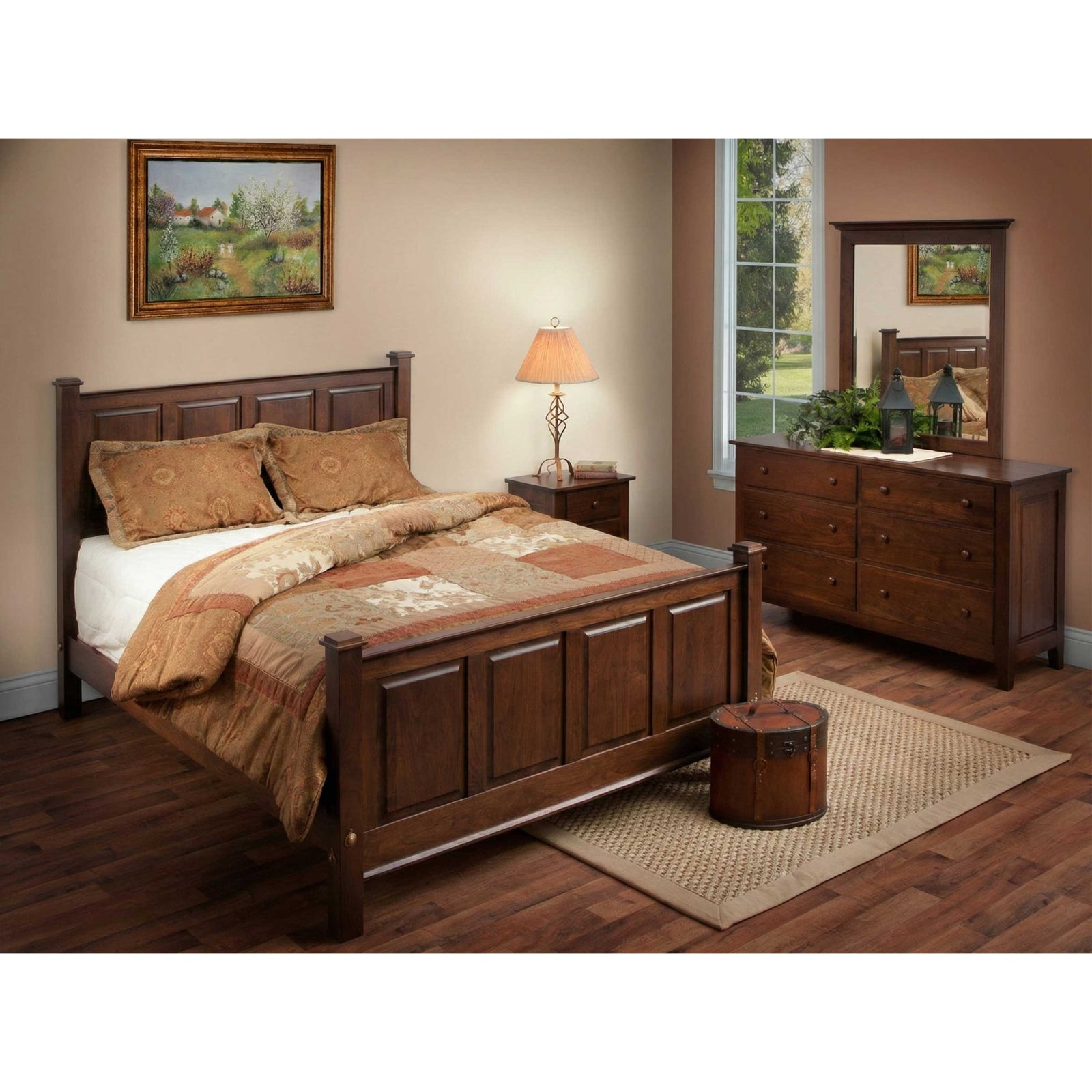 Dark cherry raised panel bed with matching nightstand, six drawer dresser and mirror in a warm bedroom