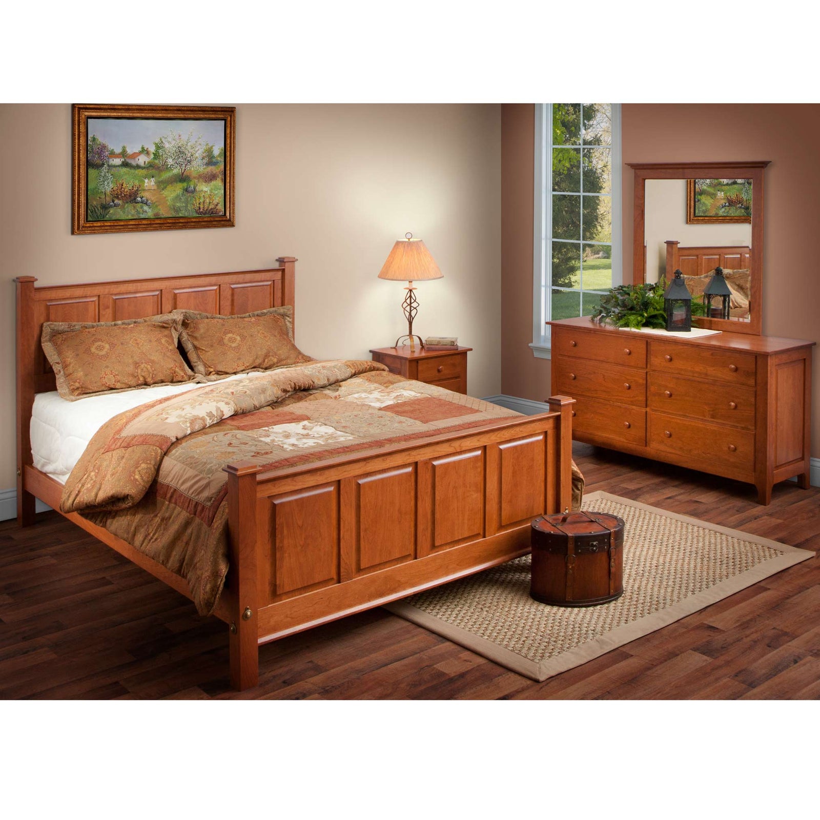 Dark cherry raised panel bed with matching nightstand, six drawer dresser and mirror in a warm bedroom