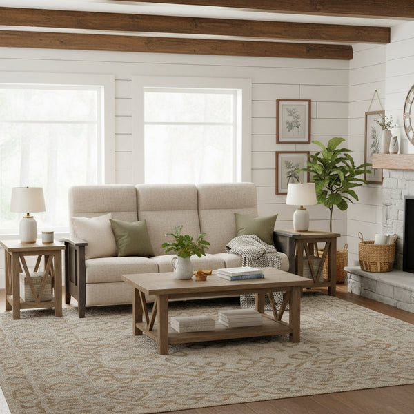 Cream reclining sofa in a farmhouse living room with shiplap walls, V base end tables and matching coffee table