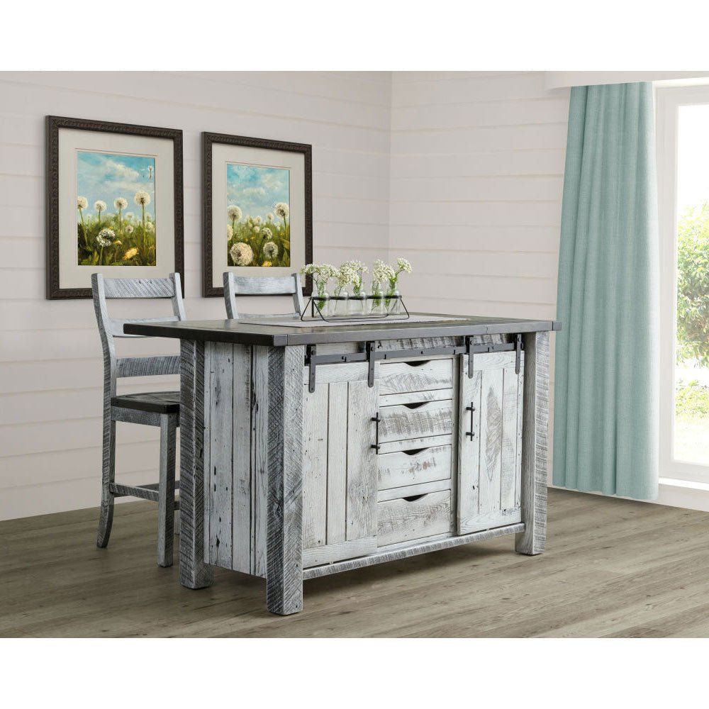 Weathered gray kitchen island paired with two ladder back counter stools in a white shiplap room with dandelion art