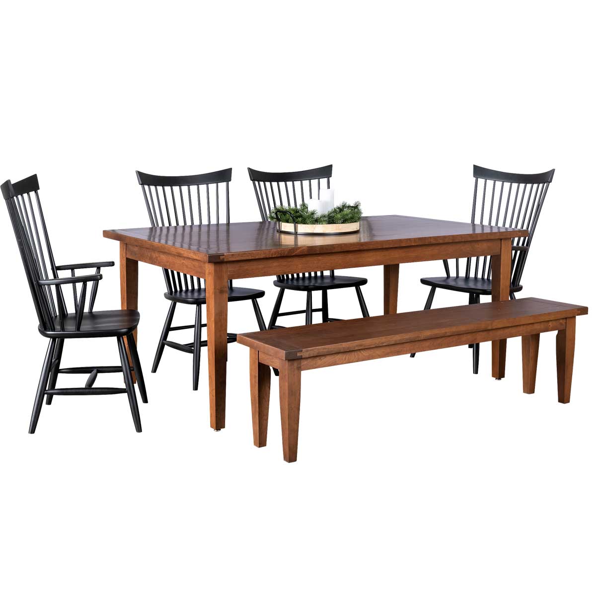 Dining set with a brown plank-top leg table, four black spindle back chairs and a matching wood bench