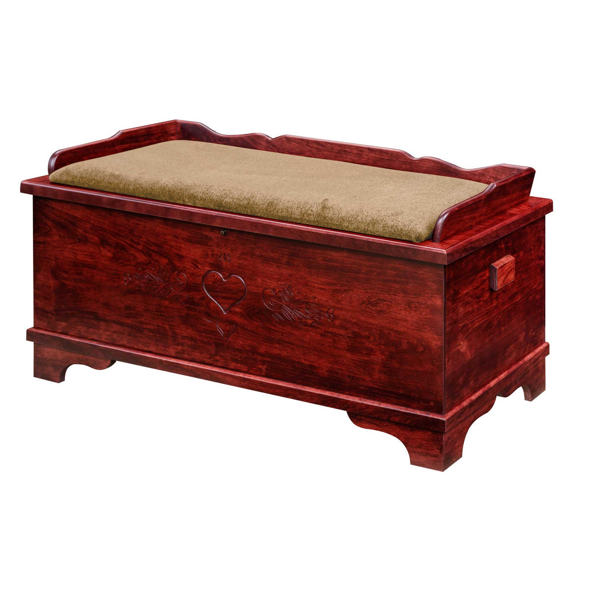 Cherry red stained blanket chest with a carved heart and tulip front, shaped back rail and tan seat cushion