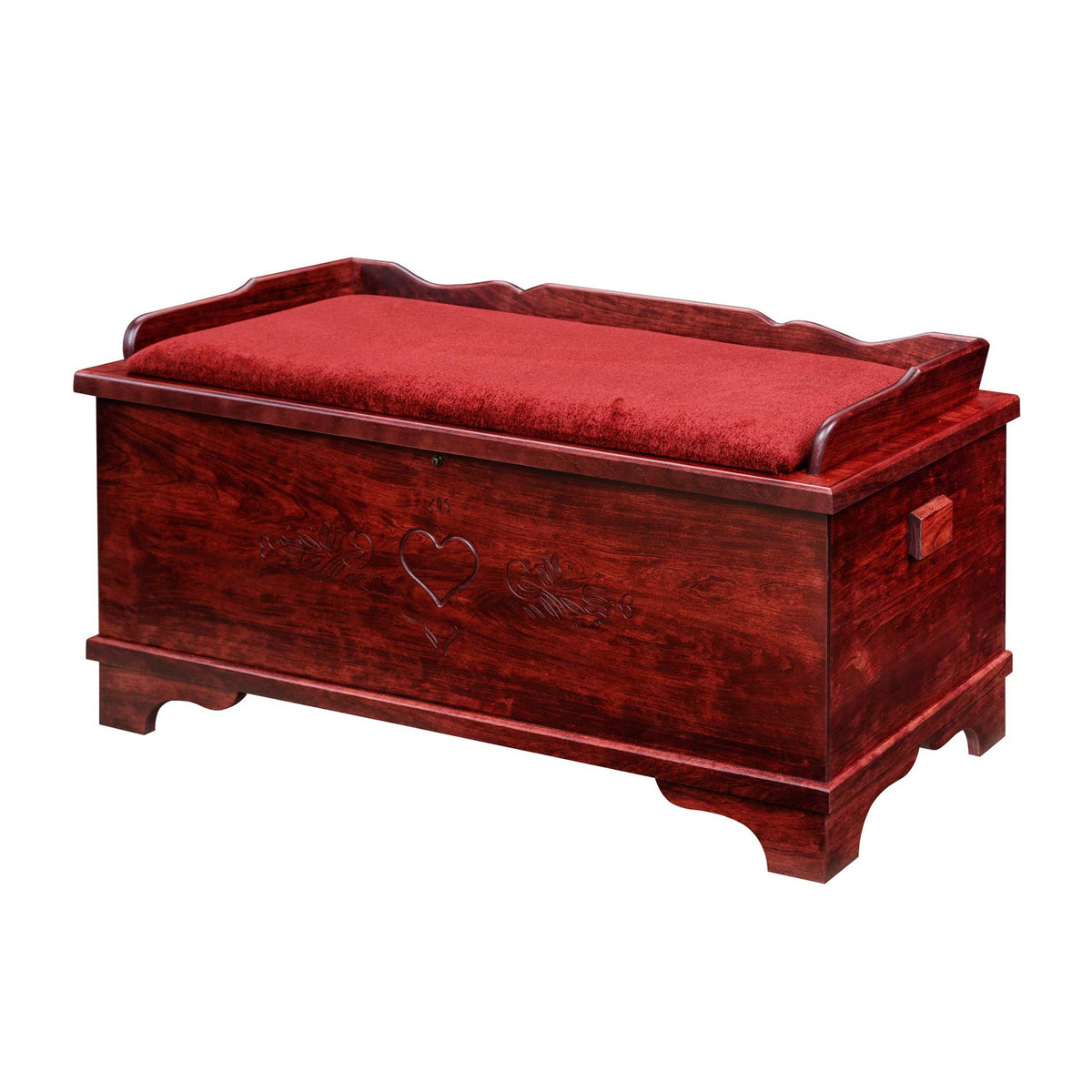 Storage bench hope chest in deep red with a red upholstered seat pad, carved heart front and side handles
