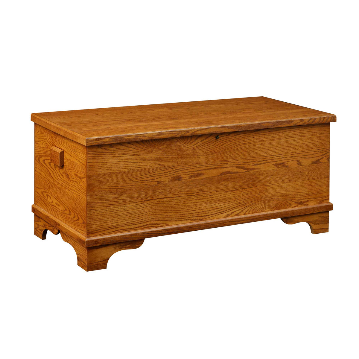 Flat top oak hope chest in a honey stain with a solid lid, square side handle and scalloped bracket base