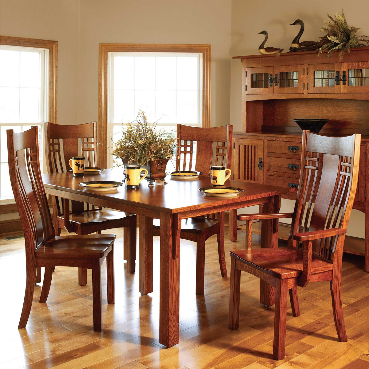 Oak dining set with lattice slat back chairs, extension table and sideboard hutch in a sunny room