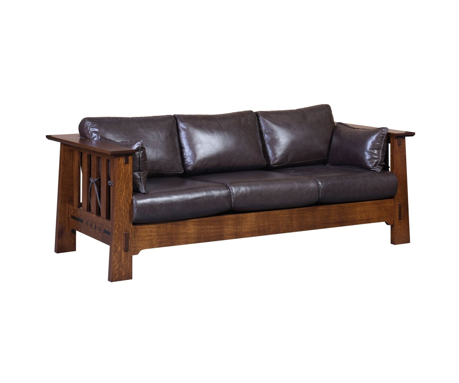Espresso leather Mission sofa with wide oak arm rails, slat sides and bolster pillows beside a slatted coffee table