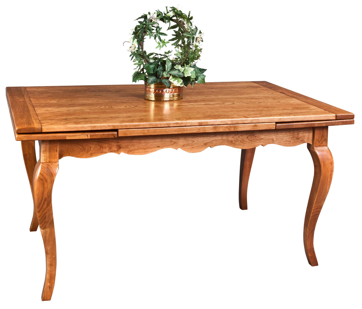 Cherry draw leaf dining table with a scalloped skirt and cabriole legs, topped with an ivy wreath centerpiece
