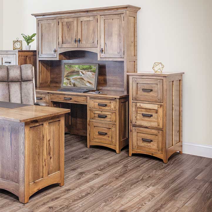 Rustic hickory three drawer file cabinet next to a credenza desk with hutch and leather chair in an office