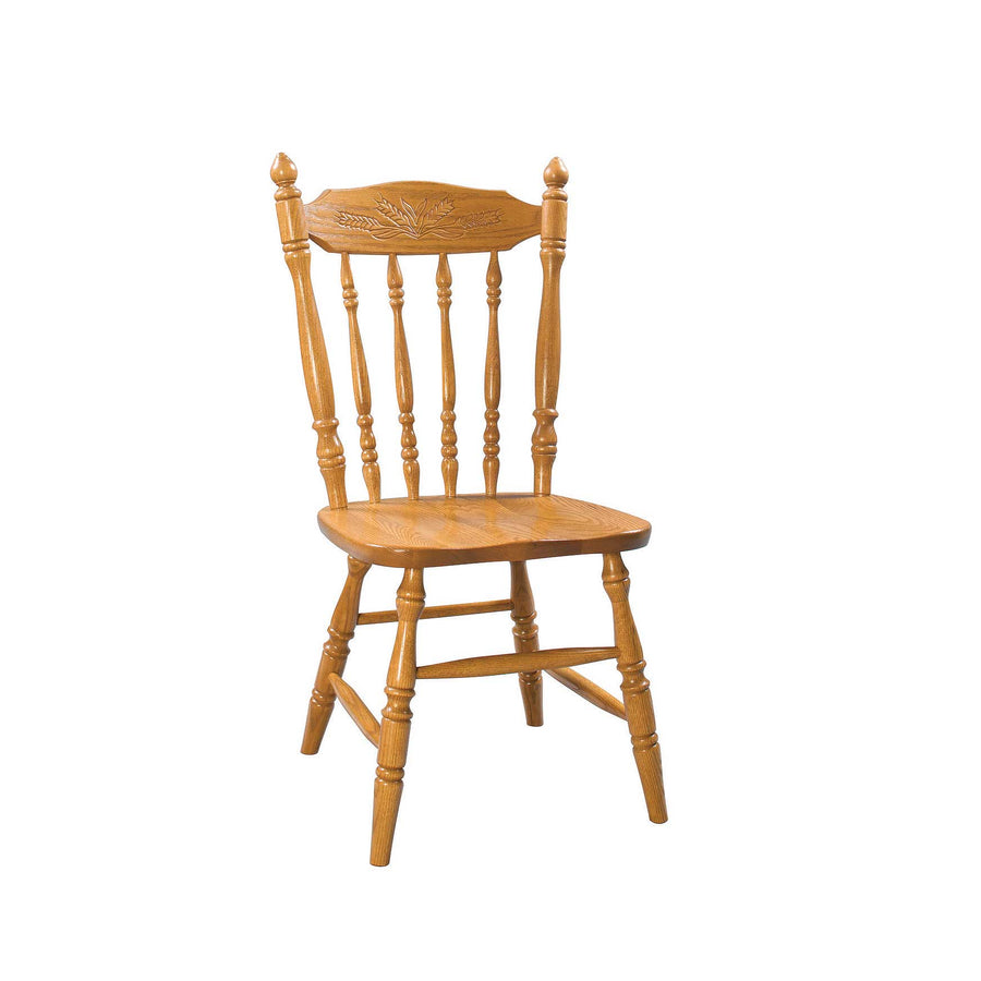 Golden oak Windsor side chair with a carved wheat back crest, turned spindles, saddle seat and turned splayed legs