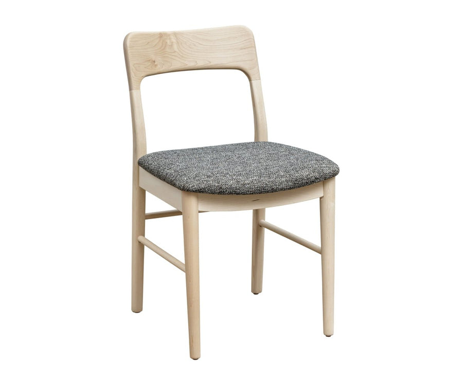 Light natural maple dining chair with a sculpted open back rail and charcoal tweed upholstered seat on a white background