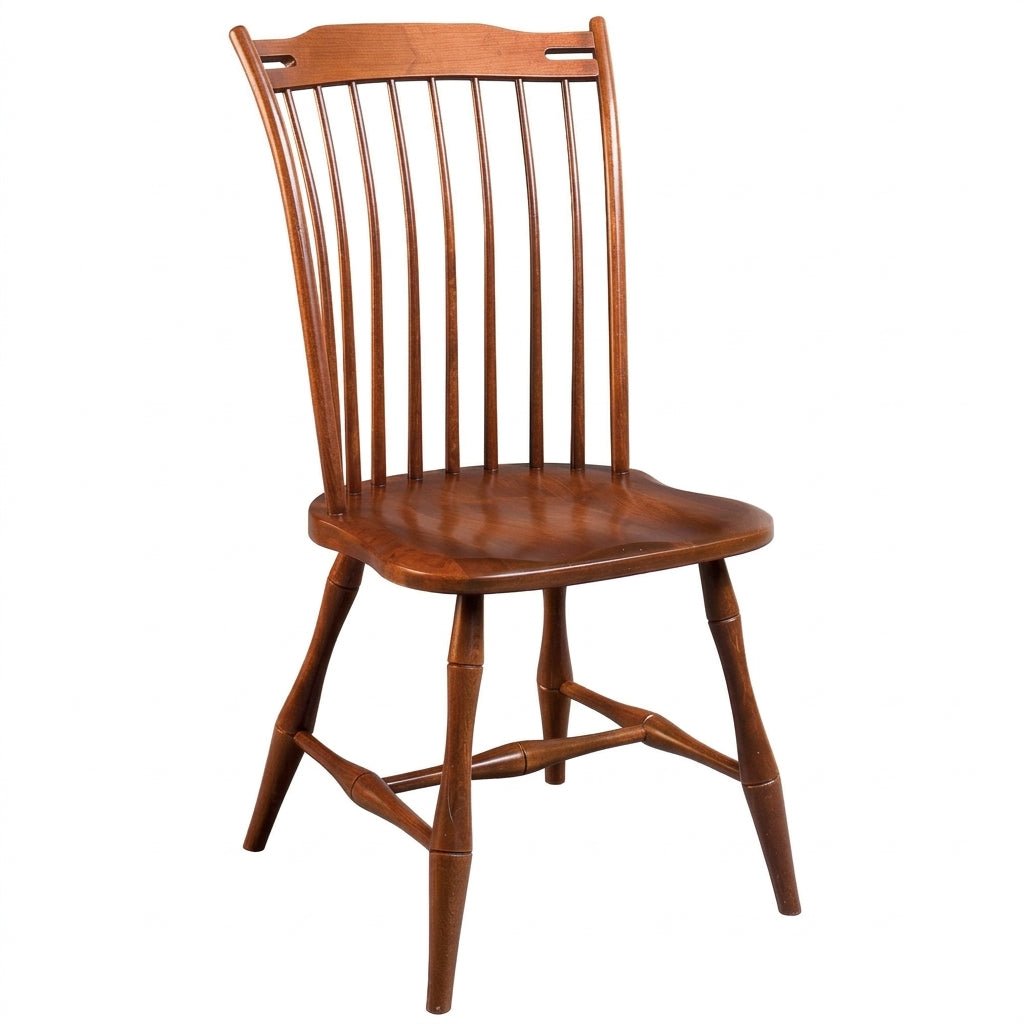 A mid-century modern wooden dining chair with a spindle back, curved seat, and tapered legs, shown against a plain white background.