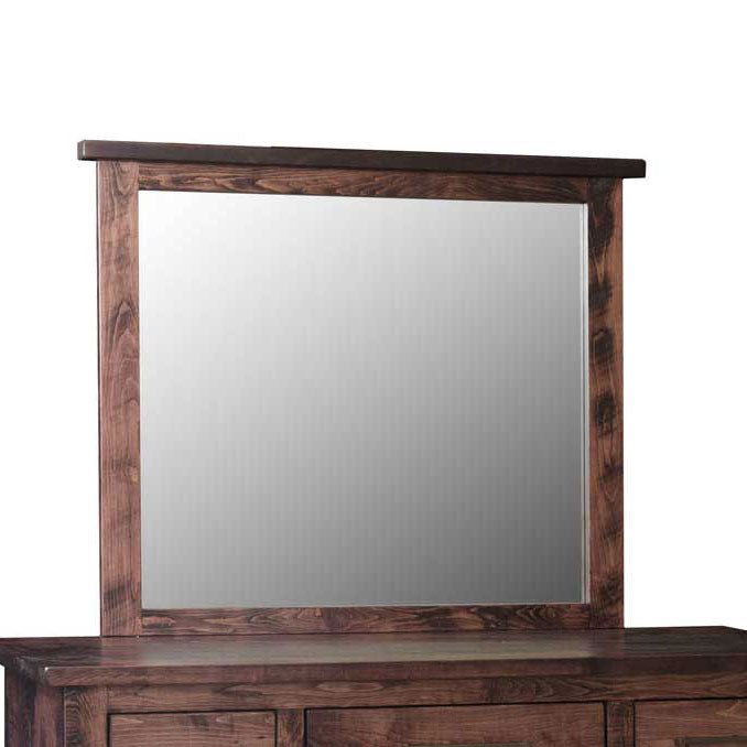 Portrait dresser mirror in rustic brown wood with a wide plank frame and thick top cap, shown on a dresser