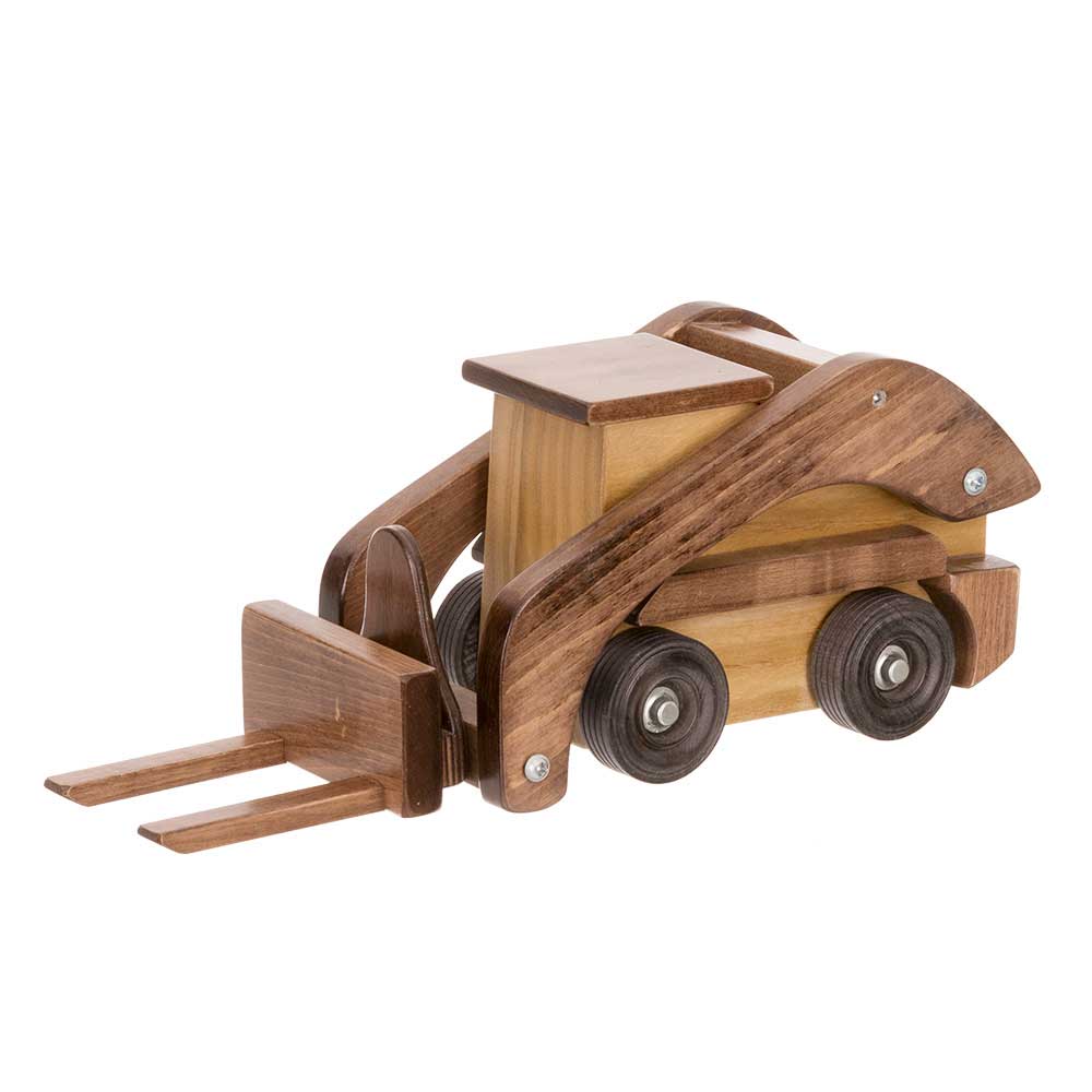 Wooden toy skid loader in a two-tone walnut and light wood finish, fitted with pallet forks and black wheels