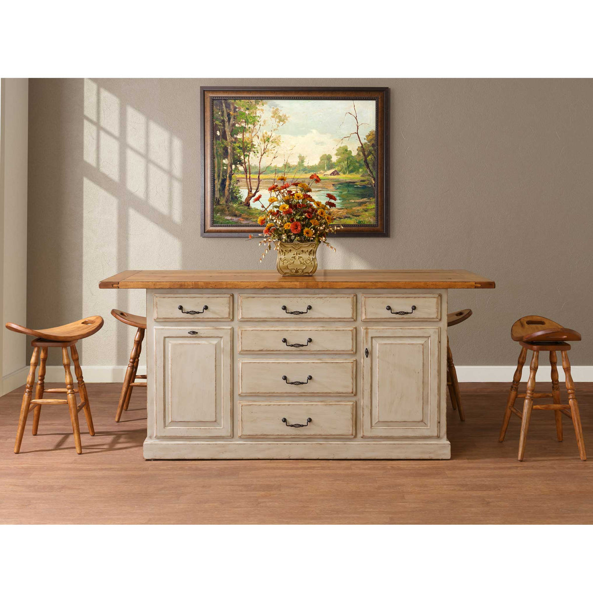 Large antique white kitchen island with six drawers and paneled doors, oak plank top and four swivel saddle stools