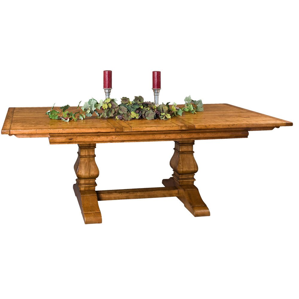Rustic honey trestle table with candles and a grapevine garland on the plank top, twin pedestals below