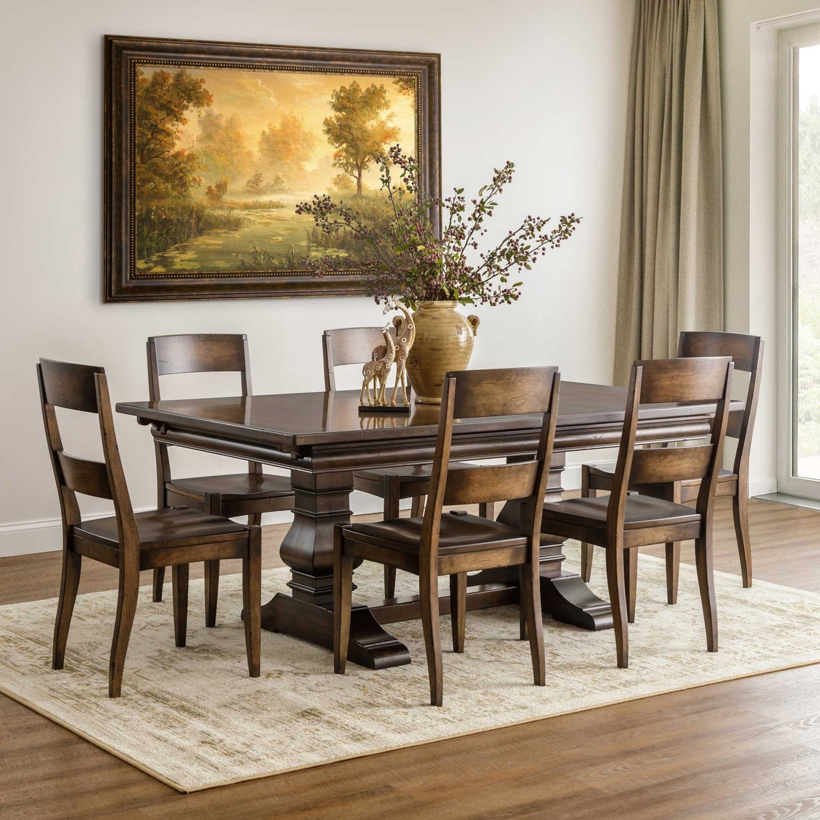 Dark walnut trestle dining table with a carved pedestal base and six panel back chairs beneath a landscape painting
