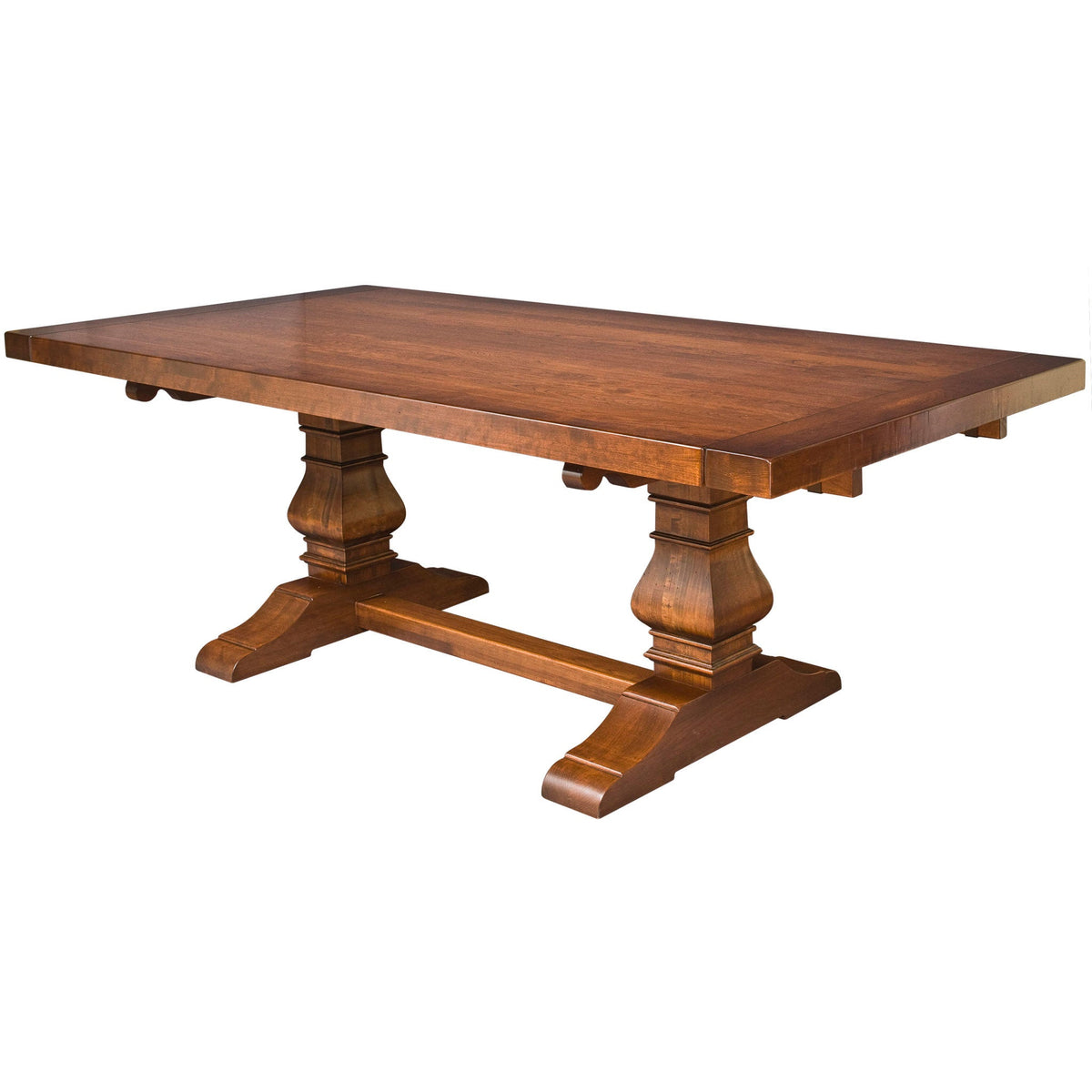 Rectangular trestle dining table in warm cherry with a thick plank top, two carved pedestals and stretcher base