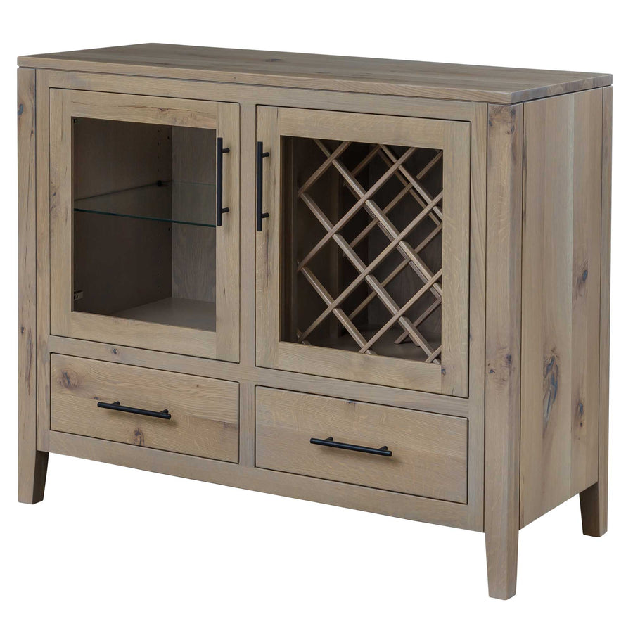 Light oak wine server with glass doors over a diamond lattice bottle rack and glass shelf above two deep drawers
