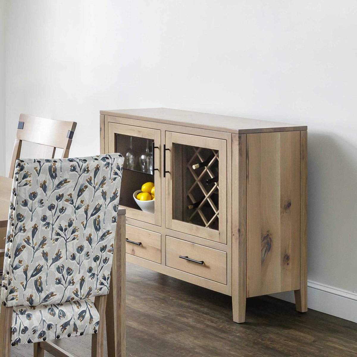 Whitewashed oak wine storage sideboard with two glass doors, a lattice wine rack, stemware shelf and two drawers