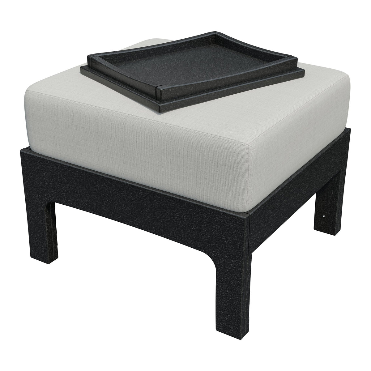 Black poly patio ottoman with a white cushion and a black hideaway serving tray placed on top
