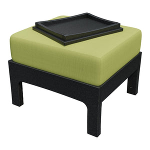 Black poly patio ottoman topped with a lime green cushion and a black hideaway serving tray with raised edges