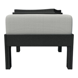 Front view of the black poly patio ottoman with gray cushion and hideaway tray tucked behind the cushion