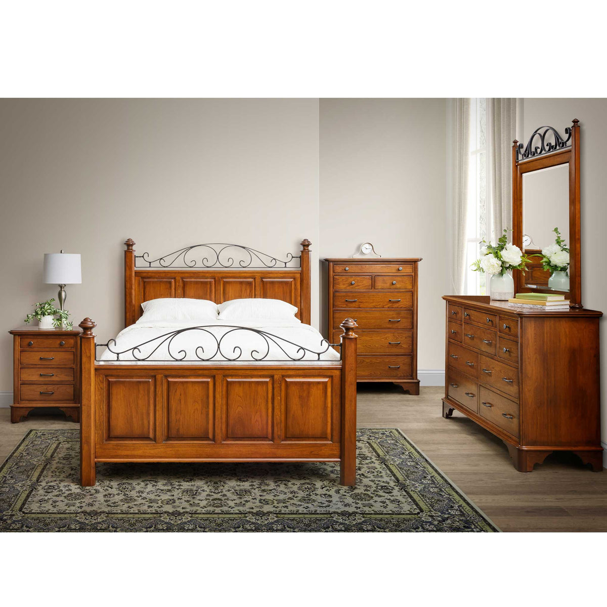 Cherry bedroom set with an iron scroll panel bed, nightstand, tall chest and dresser with mirror