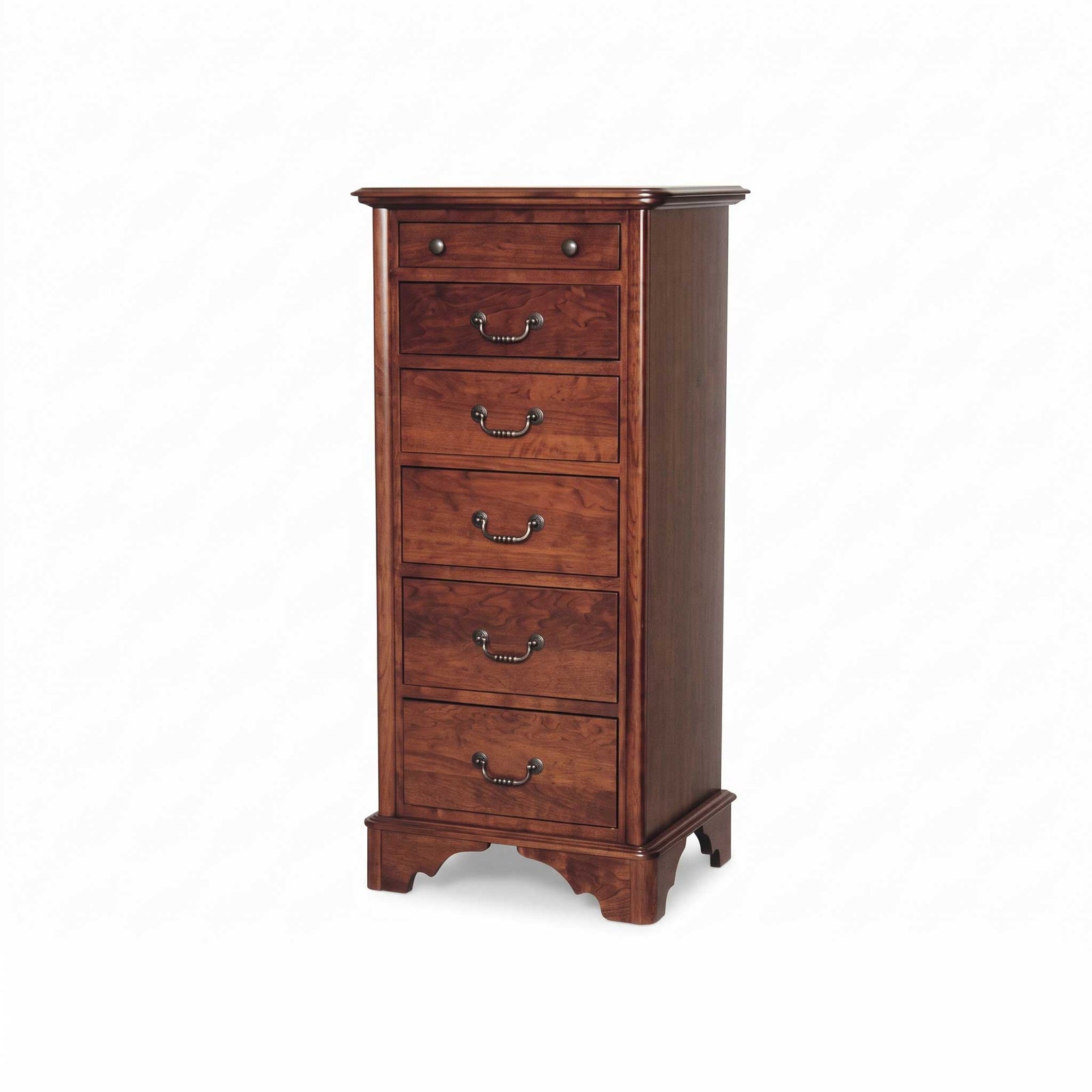 A tall, five-drawer wooden chest of drawers in a warm reddish-brown finish with brass handles, set against a white shiplap wall on a wooden floor with a woven rug.