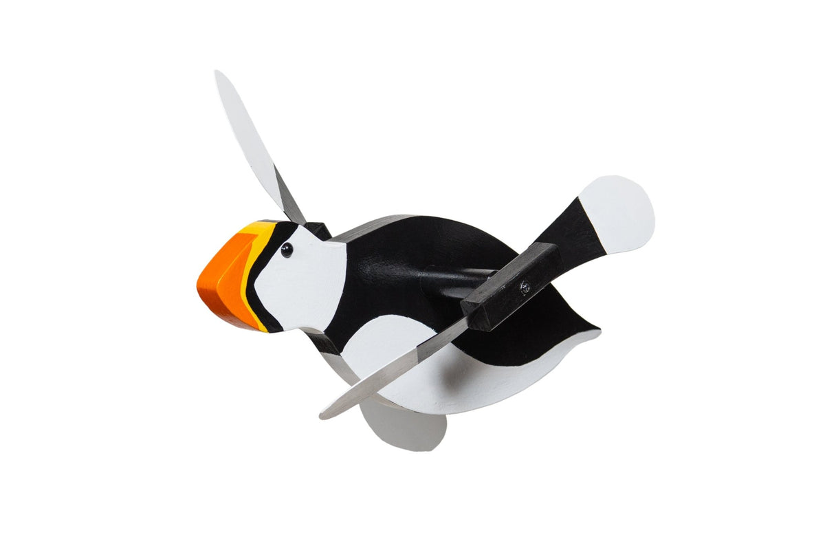 Puffin whirlybird spinner with black and white body, orange striped beak and white-tipped paddle wings, on white