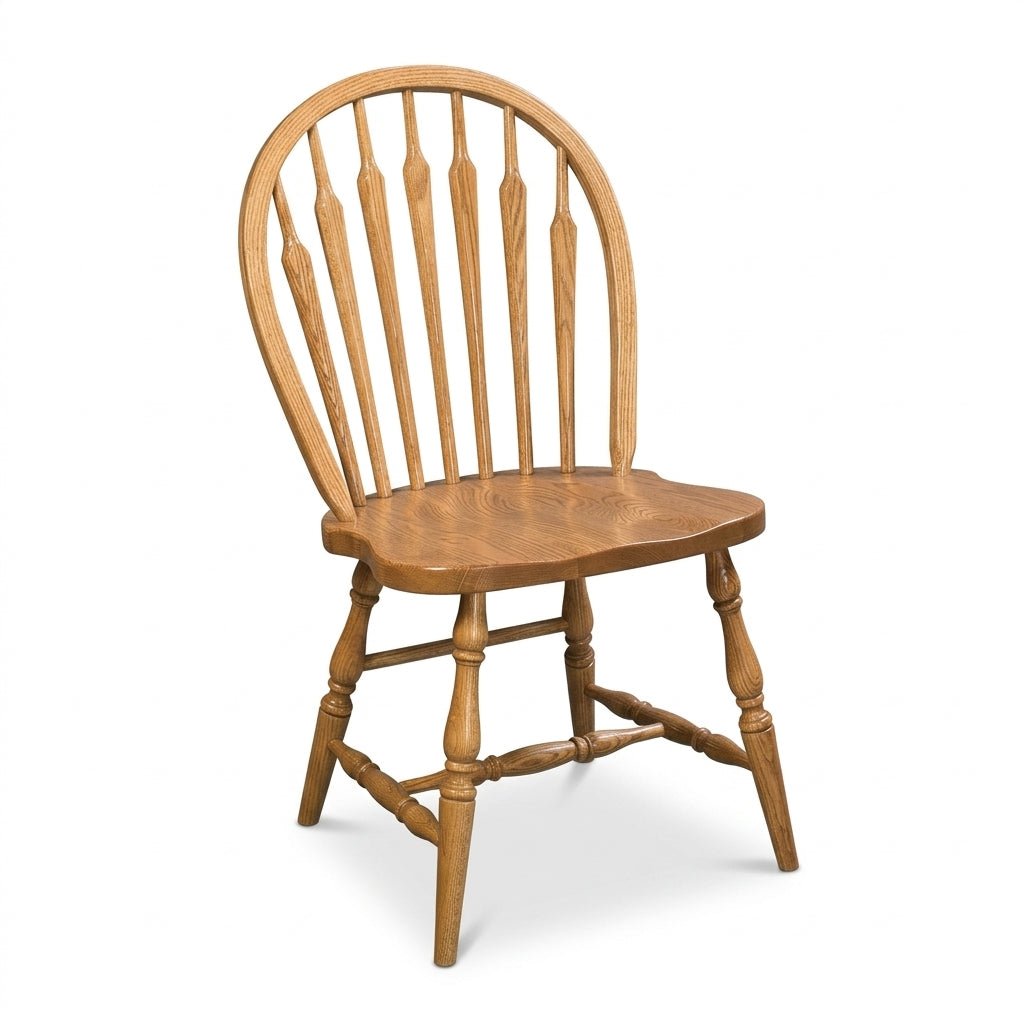 A classic wooden spindle-back chair with a warm medium-brown finish, shown from a three-quarter angle on a white background.