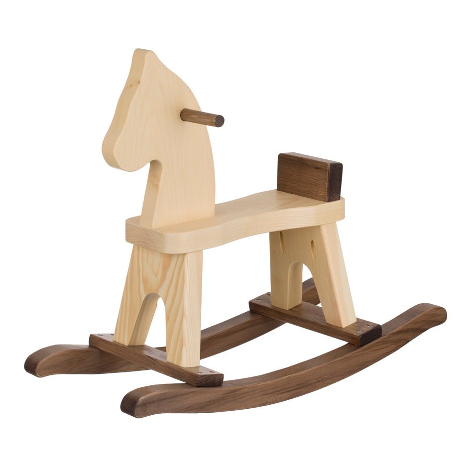 Mom steadying a toddler riding a maple and walnut wooden rocking horse in a bright playroom