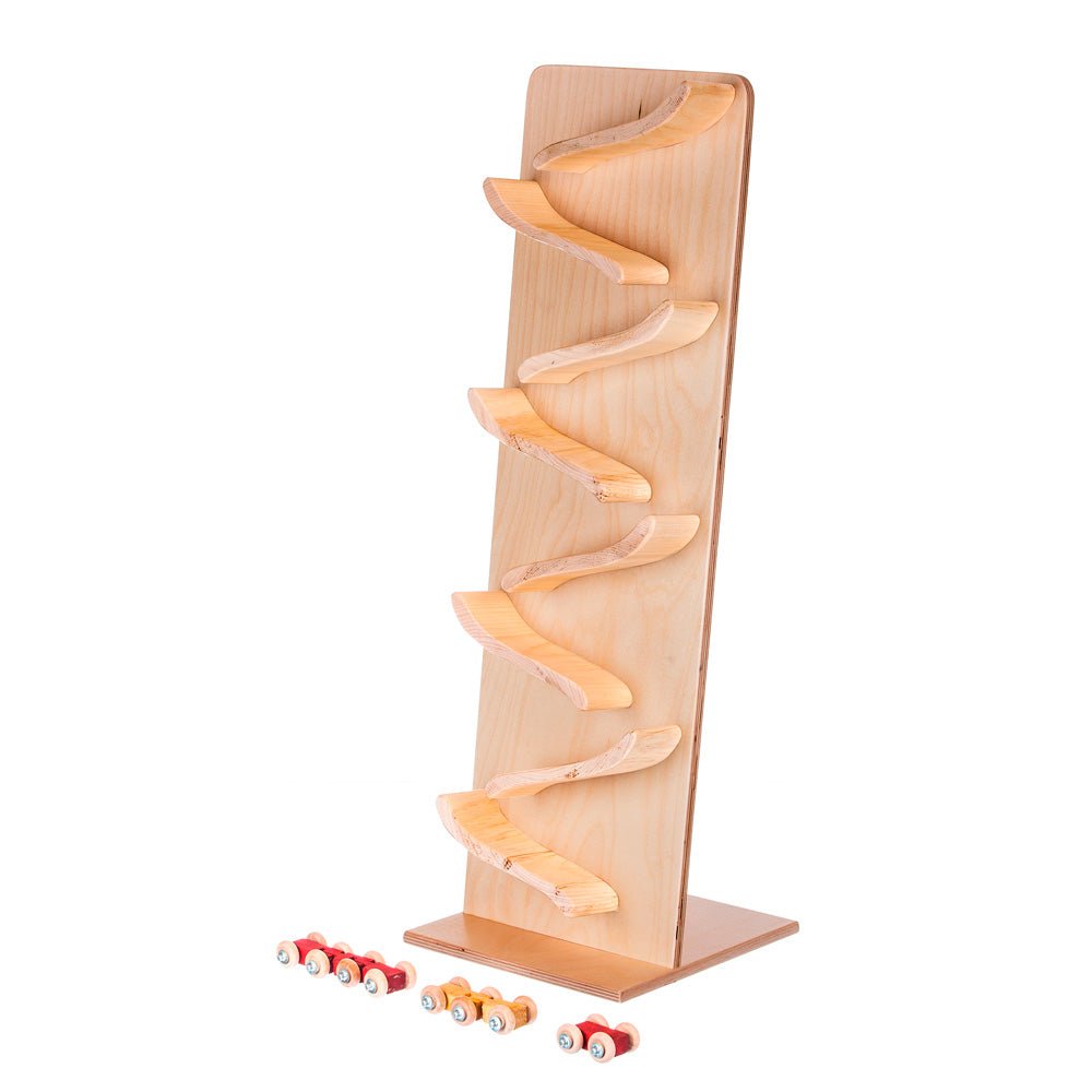 Tall maple roller tower with seven natural curved ramps and a row of small wooden cars along the base