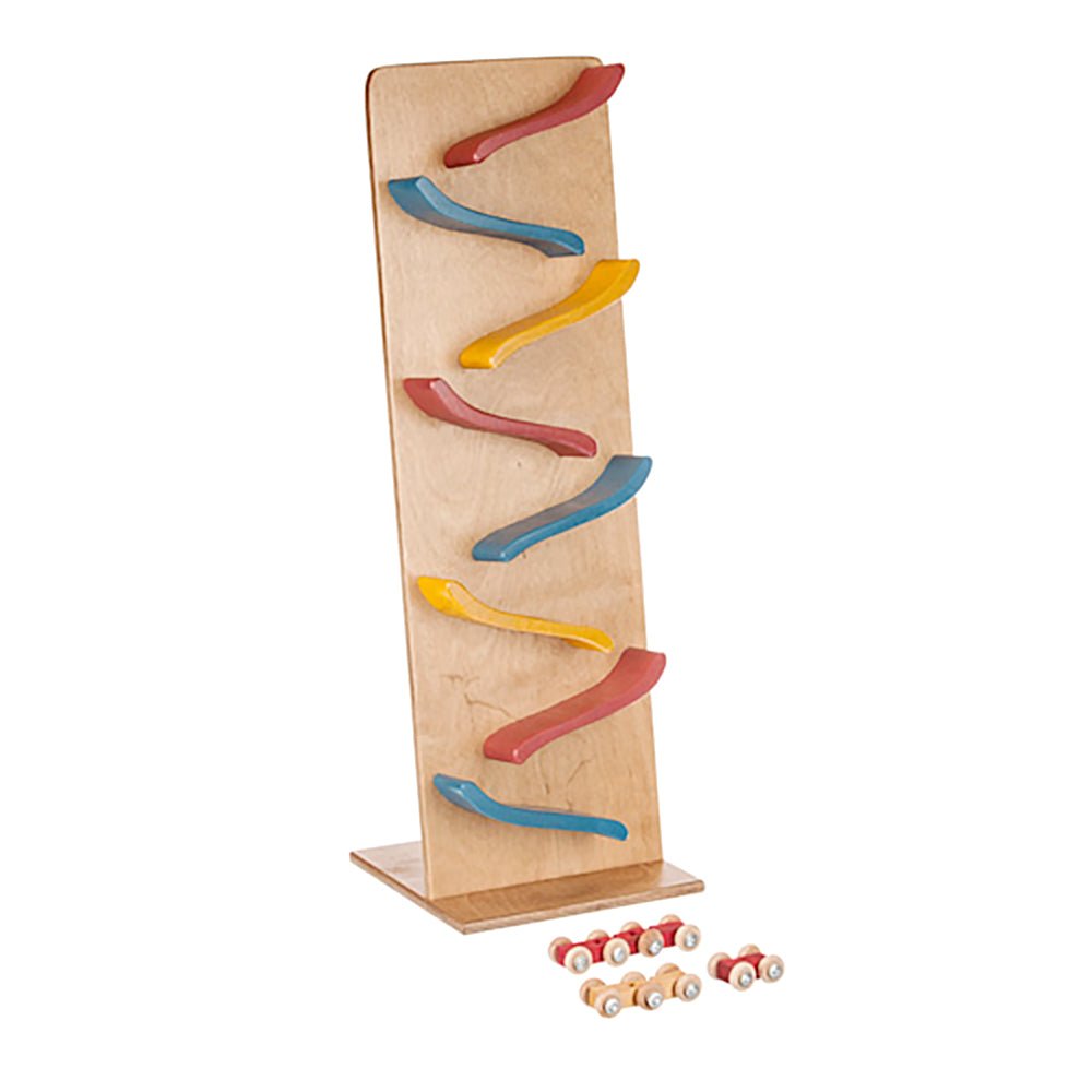 Tall maple roller tower with seven natural curved ramps and a row of small wooden cars along the base