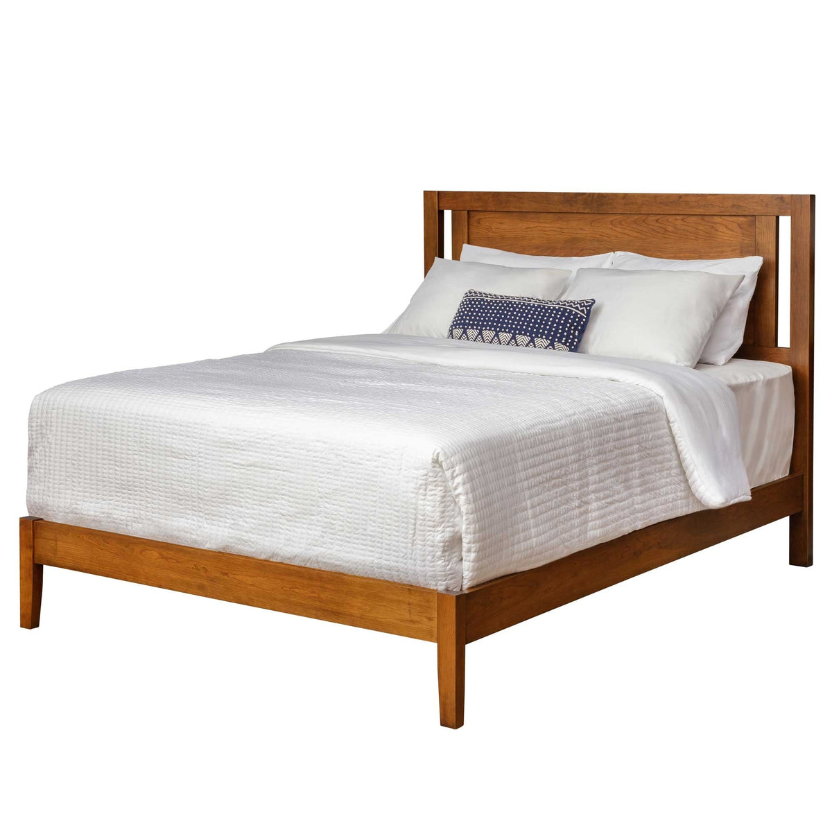 Modern Shaker platform bed in light chestnut wood with a slim panel headboard, low side rails and white quilted bedding