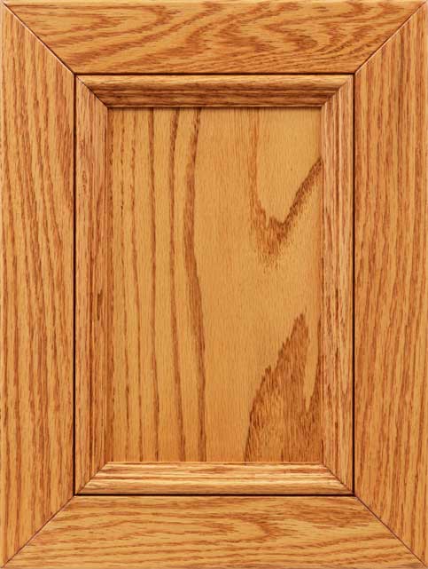 Autumn Wheat stain on oak shown as a raised panel cabinet door in light golden honey tones with visible grain
