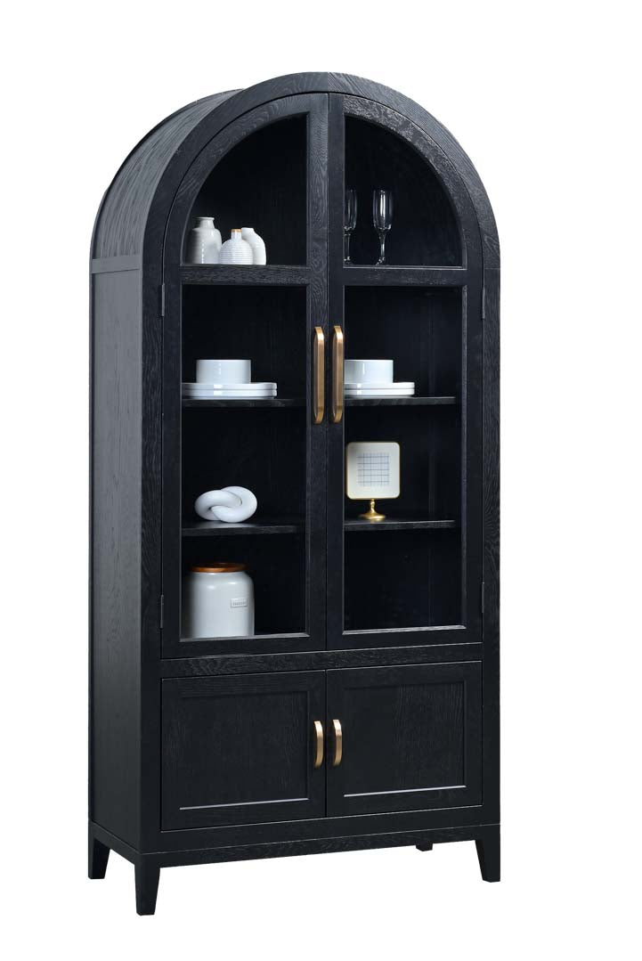 A tall black arched hutch cabinet with glass upper doors, open shelves displaying white dishes, and two lower doors with gold-toned handles, shown on a plain white background.