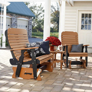 Cedar and black poly patio glider bench and matching glider chair with a small side table on a paver patio by a white porch