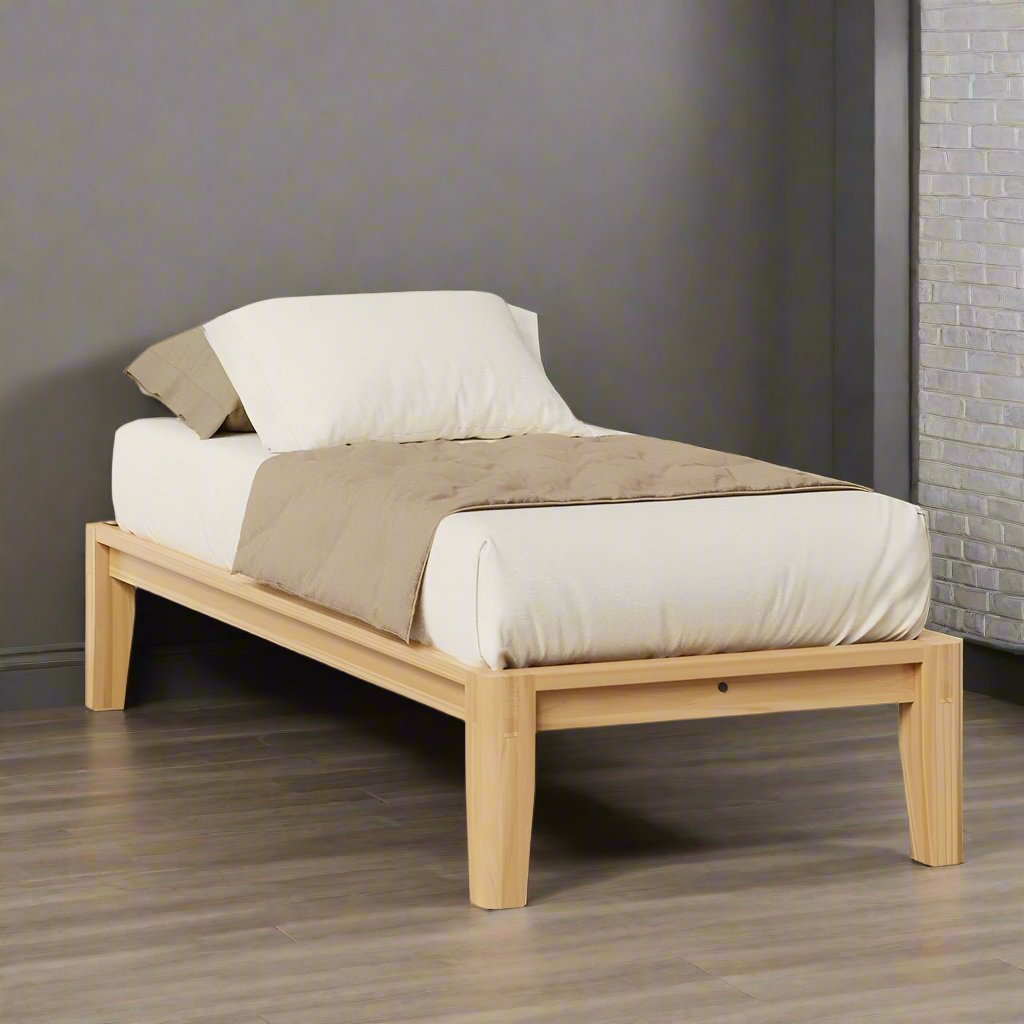 Twin size natural wood platform bed without headboard, low profile rails and mattress with white and taupe bedding