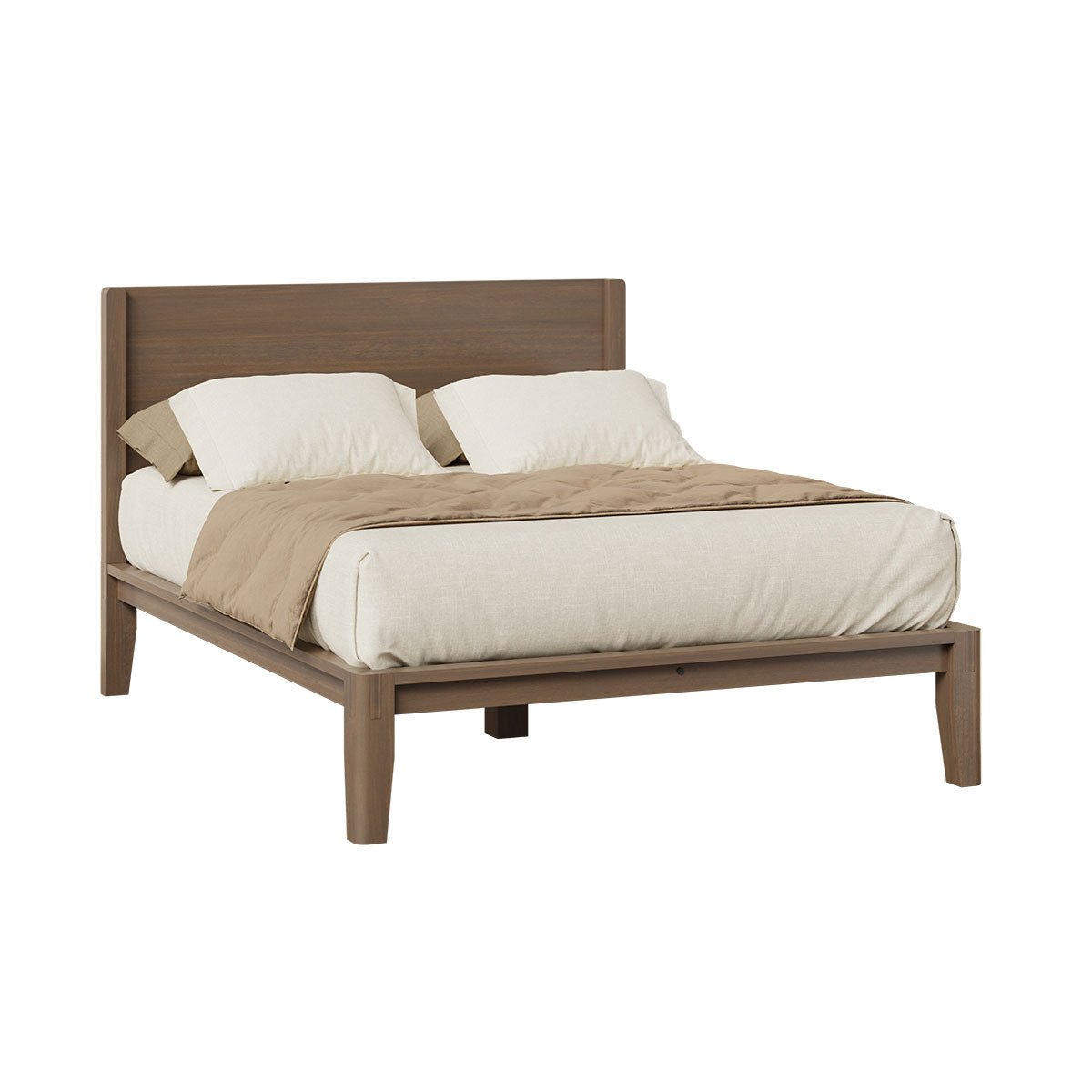 Angled view of a walnut finished platform bed with wide plank headboard, low rail frame and tapered legs on a white background