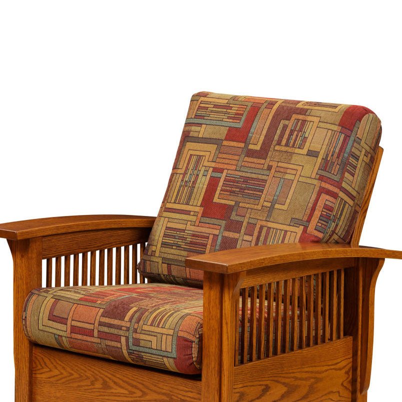 Corner view of a Mission oak chair fitted with replacement seat and back cushions in a geometric multicolor block fabric