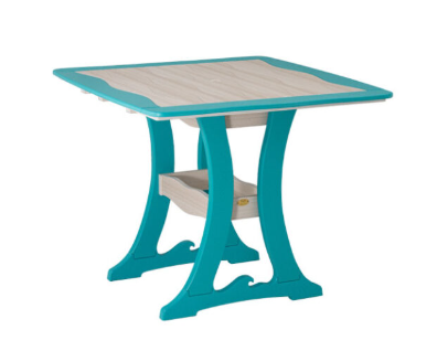 Square poly patio table with a wave-pattern sand and aruba blue top on curved turquoise trestle legs with a lower shelf