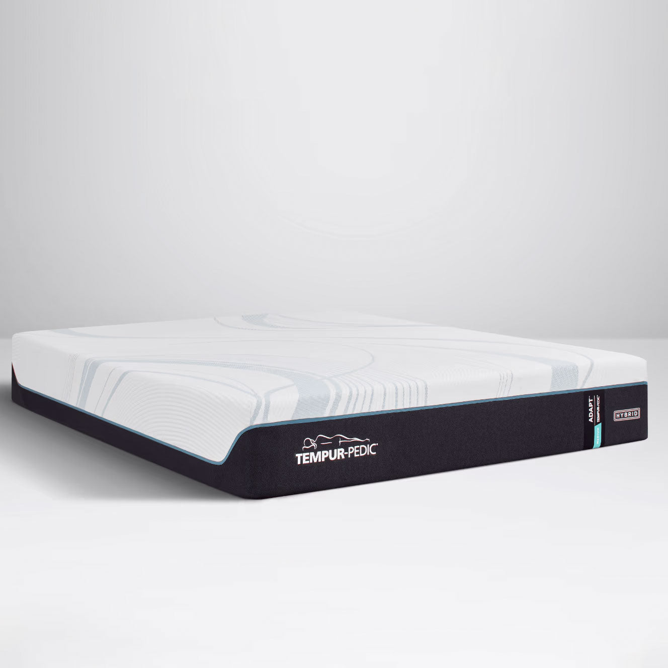 Medium hybrid memory foam mattress with a white swirl-knit top and charcoal border, shown at an angle on gray