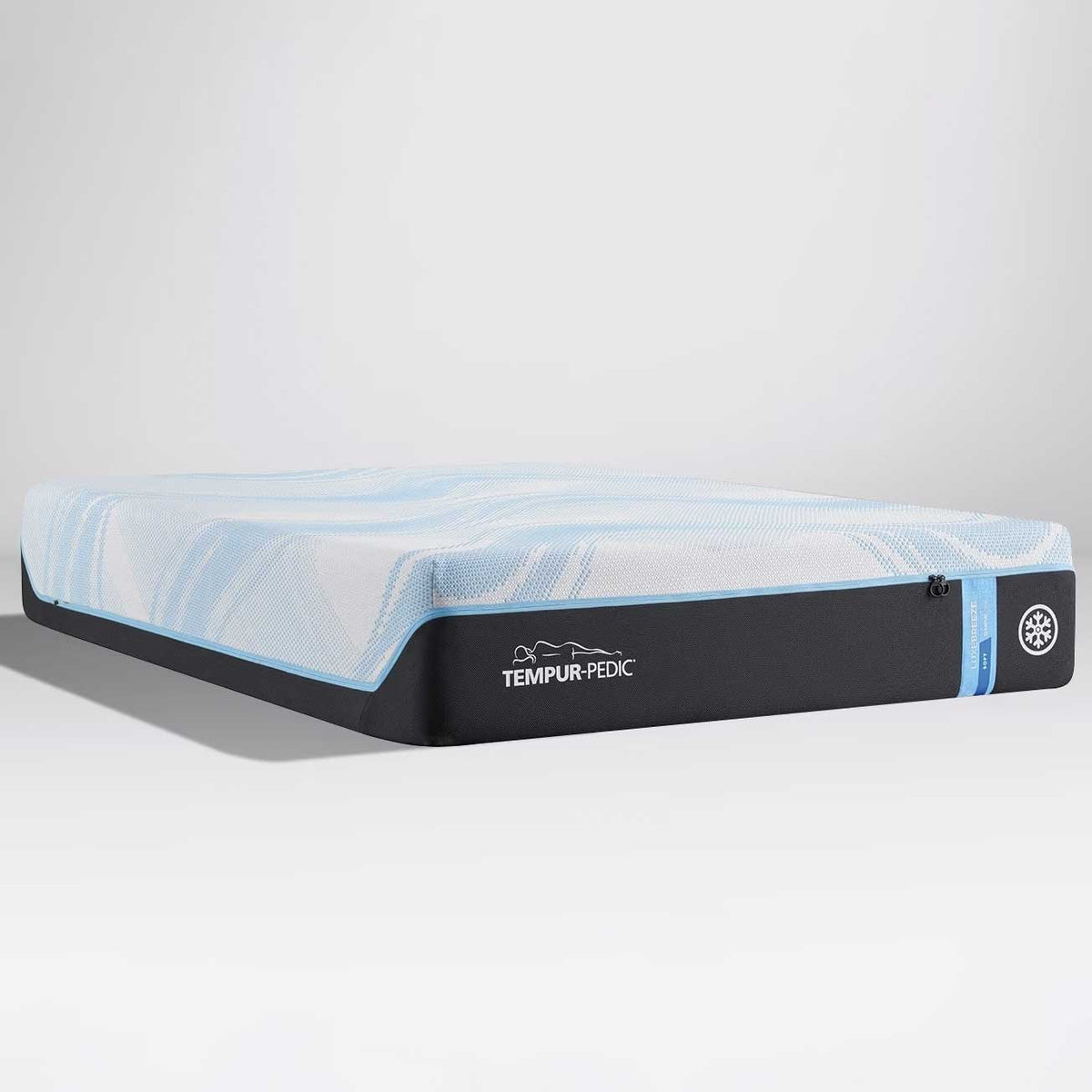Blue and white cooling memory foam mattress with charcoal border shown at an angle on a light gray background
