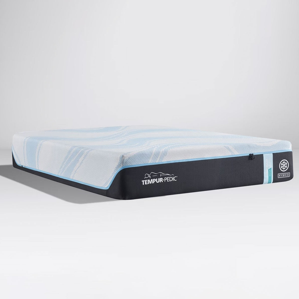 Cooling hybrid mattress with a blue swirled knit top and charcoal border shown at an angle on a gray background