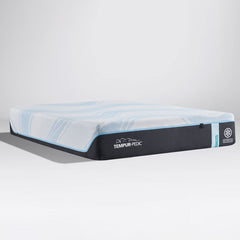 Cooling hybrid mattress with a blue swirled knit top and charcoal border shown at an angle on a gray background thumbnail