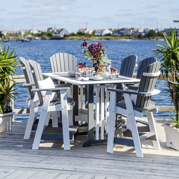 Six gray and white poly bar chairs around a square balcony table with brunch spread on a dock