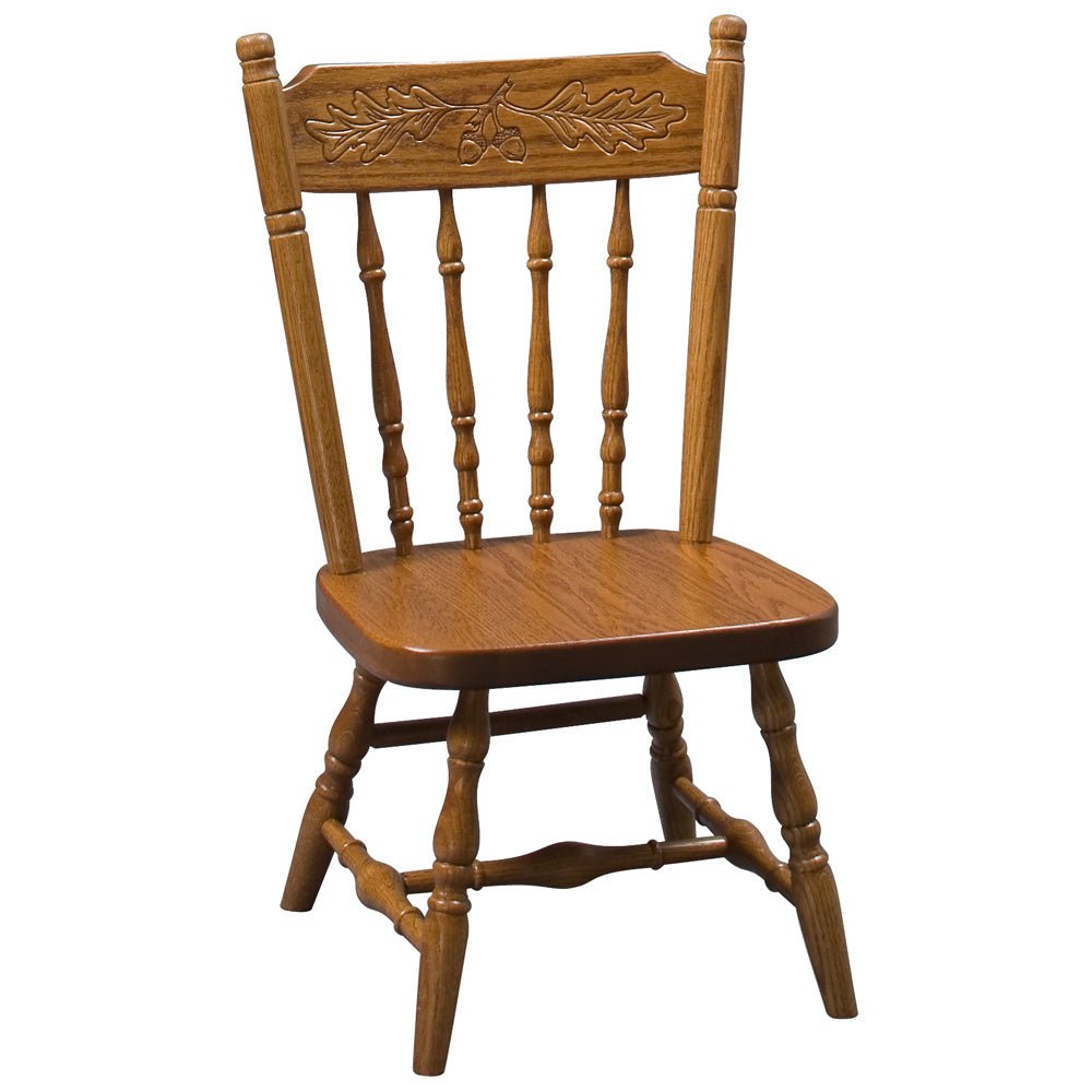 Kid's oak dining chair with turned spindles, carved acorn and oak leaf crest rail and a contoured saddle seat