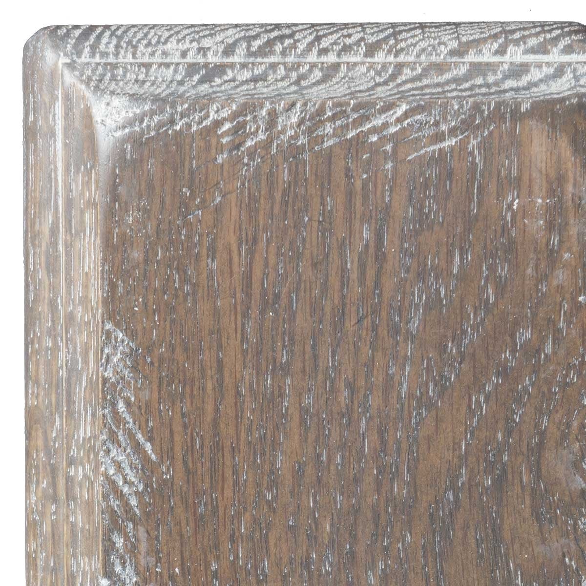 Whitewash Smoke on oak, gray-brown limed sample corner with white filling the open grain pores and a rounded molding profile